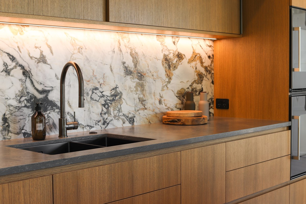 modern kitchen close up of sink space with veneer cabinetry 